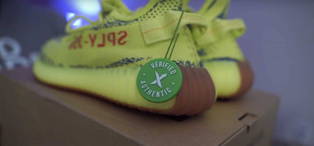 StockX tag on the left shoe of Yeezy Semi Frozen Yellow