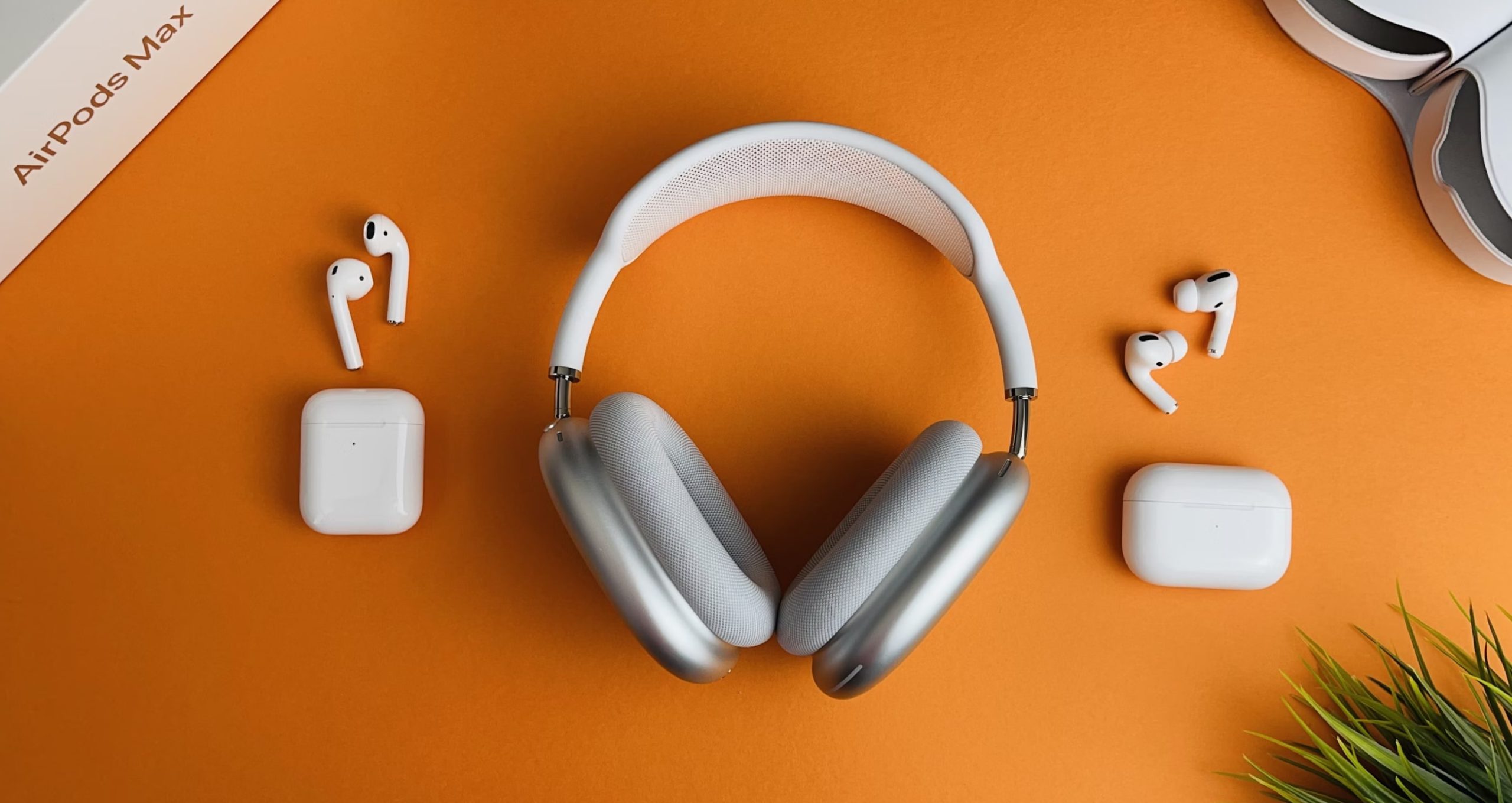 AirPods 2 (Left), AirPods Max (Middle), and AirPods Pro (Right) on an orange surface